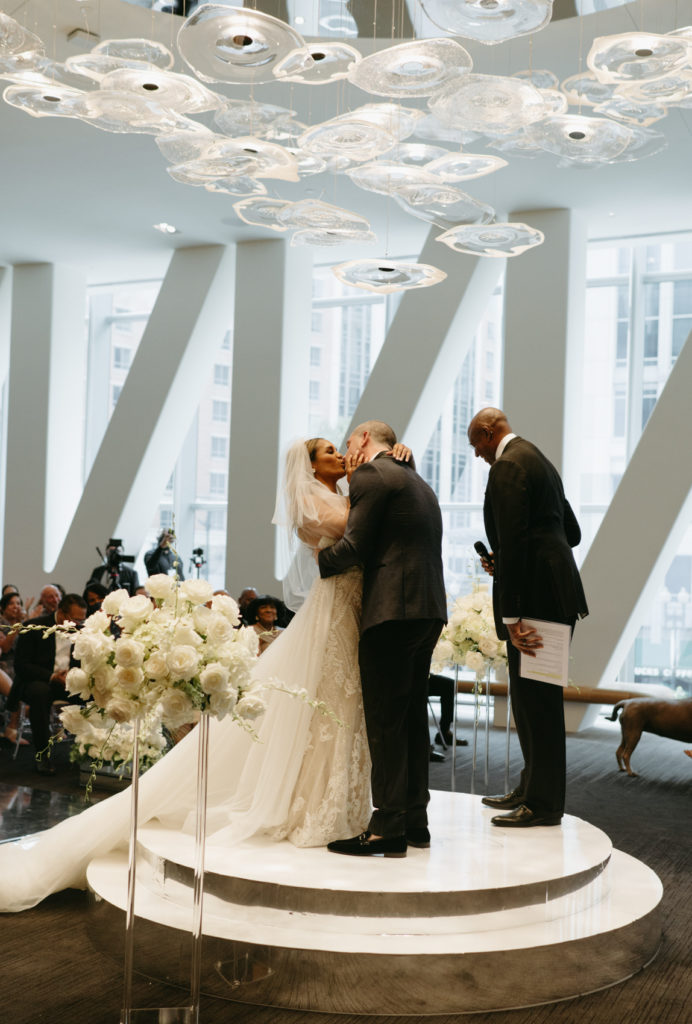 The first kiss, and a white floral arrangement