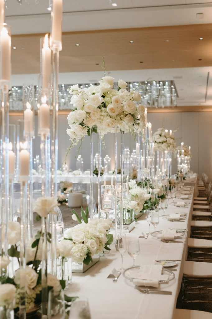 Tall and Low White Floral centerpieces for a wedding reception