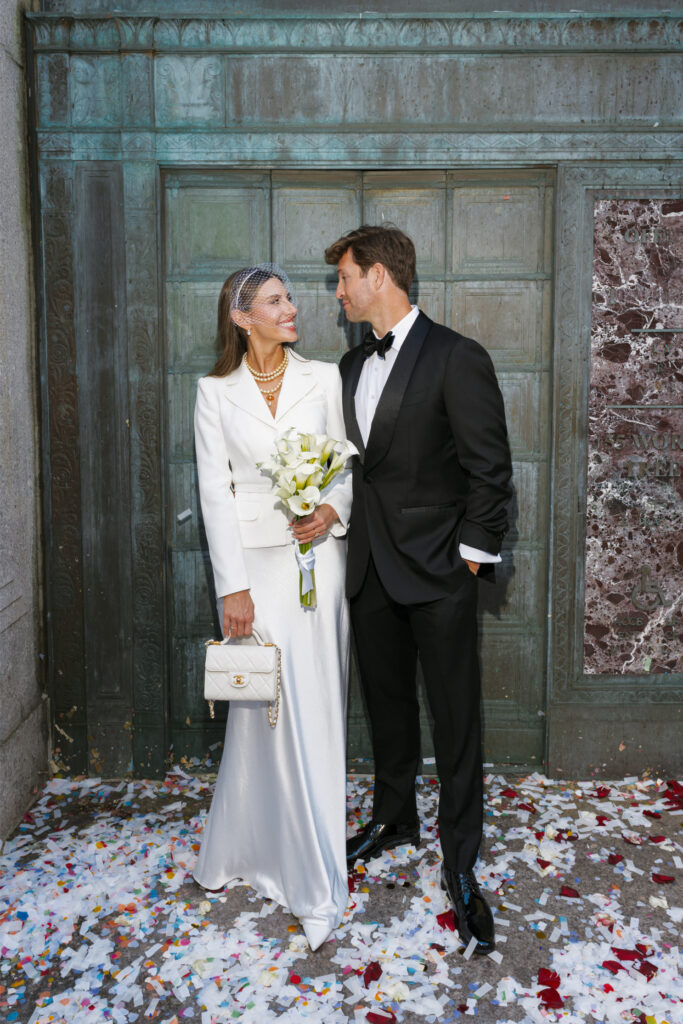 Bride and groom exchange ecstatic smiles after their NYC elopement.