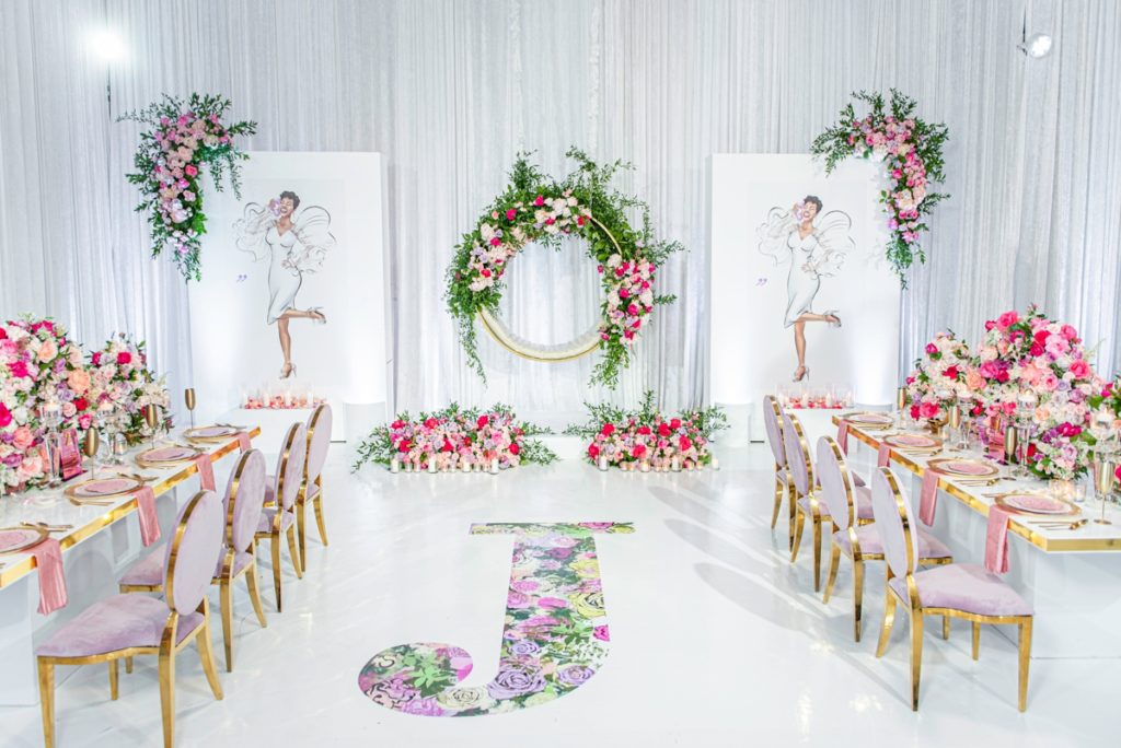 Wide picture of pink, gold and white bridal shower decor for a luxury wedding shower.