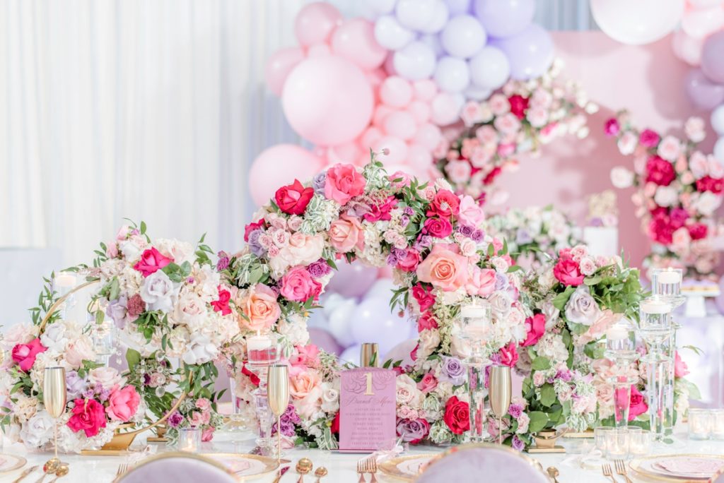 Unique pink purple floral circle wedding shower centerpieces on a luxury tablescape