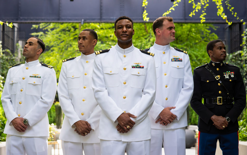 Groom with groomsmen in white navy military uniform