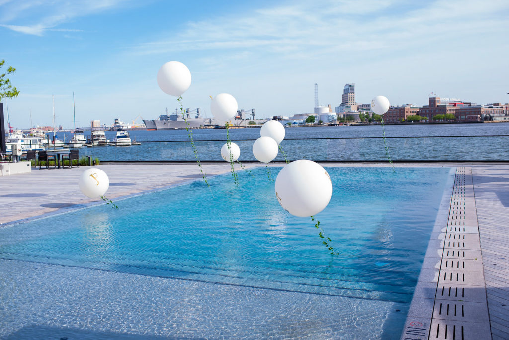 Waterfront pool at Sagamore Pendry Baltimore with balloons