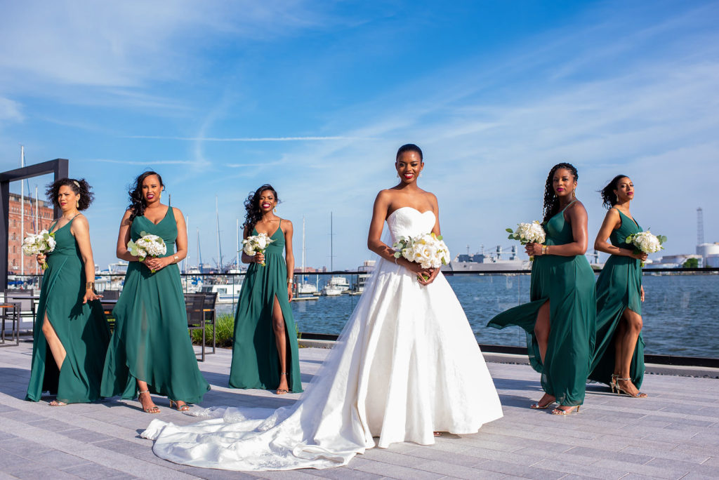 Bride with bridesmaids in emerald green bridesmaid dresses