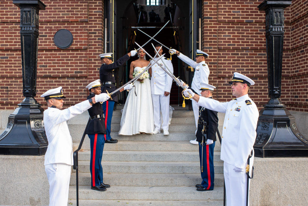 Bride and groom at naval sword ceremony