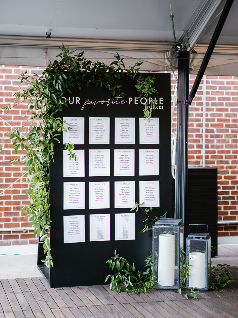 black and white seating chart with greenery "our favorite people"