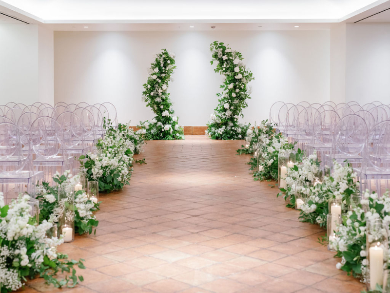 white and greenery wedding ceremony decor