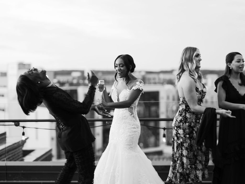 black and white photos of bride mingling during cocktail hour