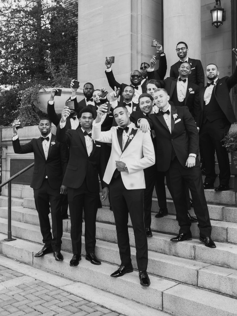 large wedding party photos with groom and groomsmen