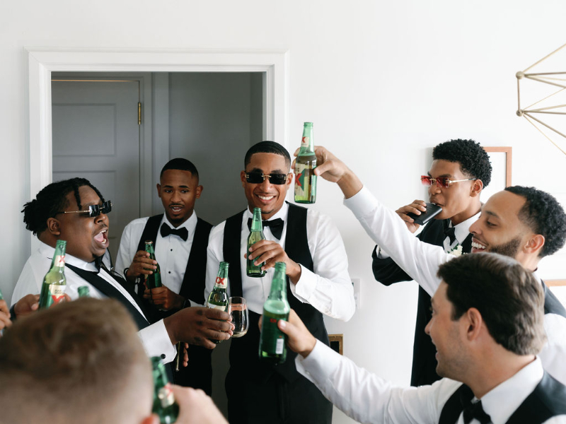 grooms toast with beer morning of the wedding