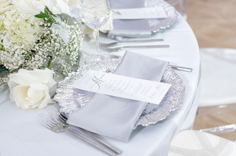 stunning silver linens, charger plates, and menu cards