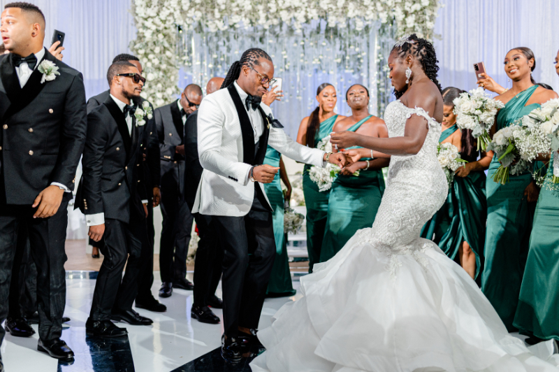 bride and groom start dancing at wedding reception