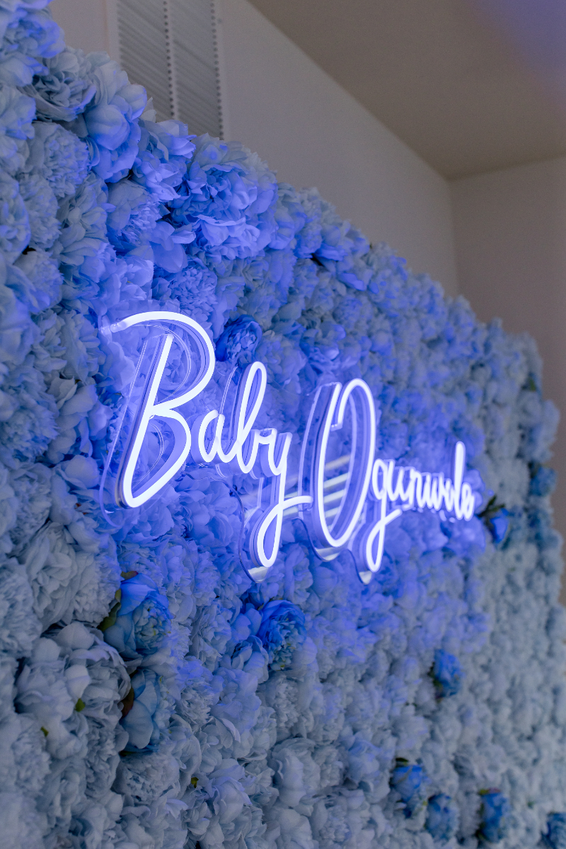 neon sign and floral wall for baby shower