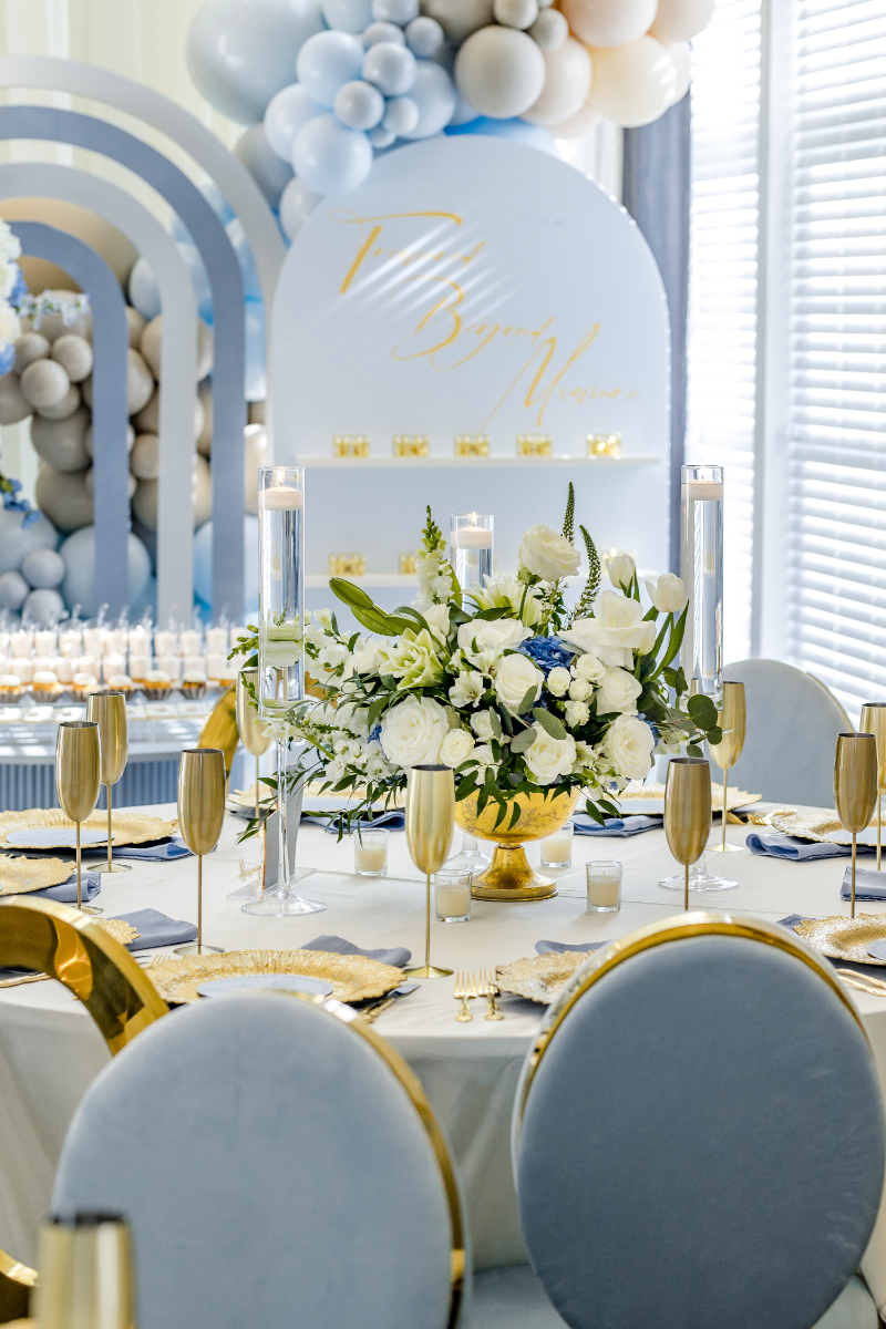 ethereal baby shower table decor in blue gold and white