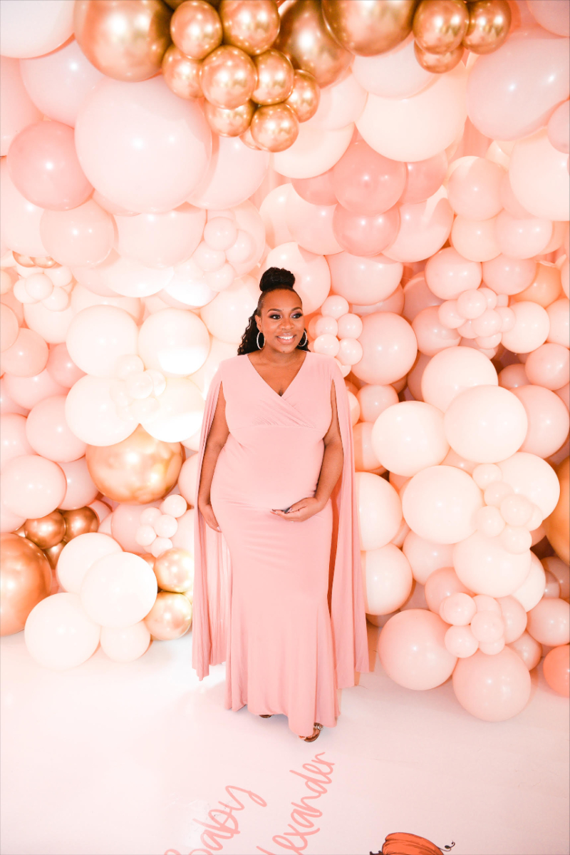 maternity photos in front of balloon display
