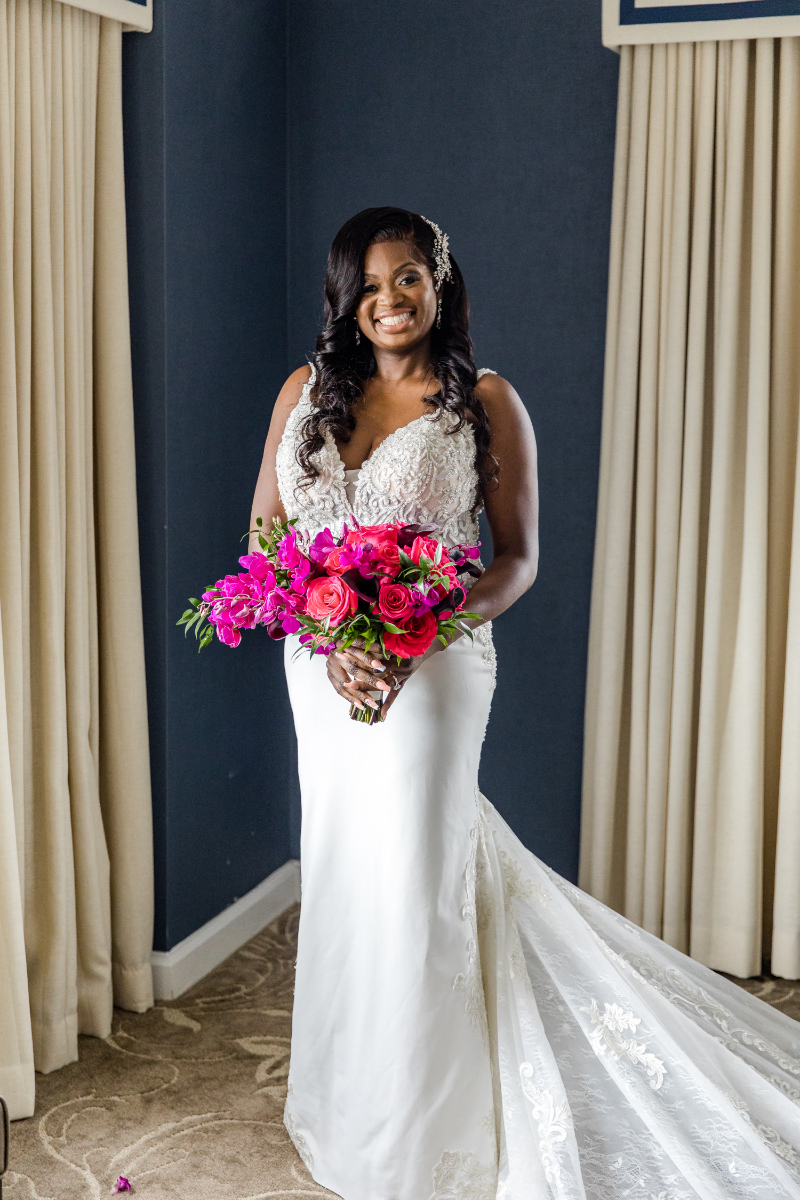bridal portrait with bright pink and purple bouquet