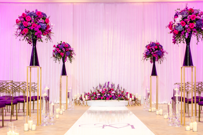pink and purple wedding ceremony decor