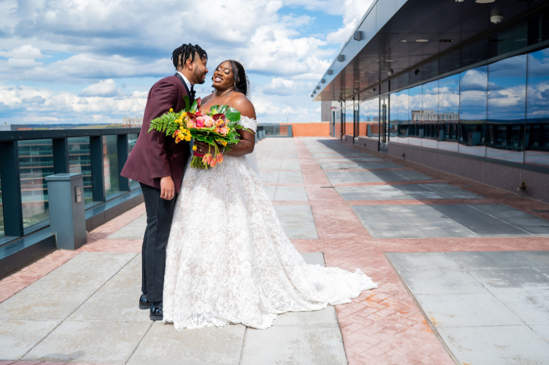 bride and groom photos on the rooftop of Hotel at the University of Maryland