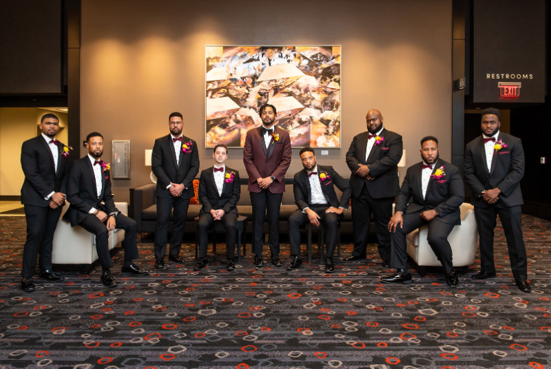 groom pose with groomsmen at Hotel at the University of Maryland