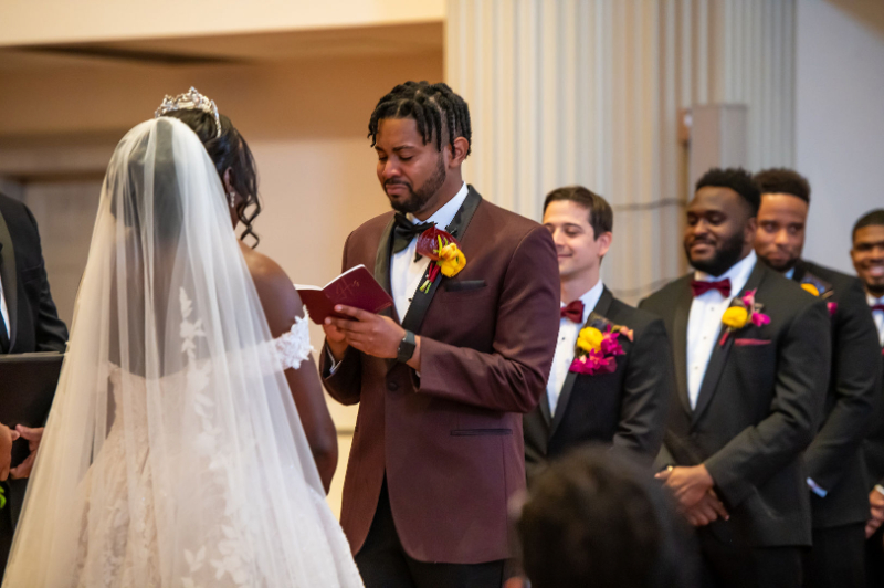 groom reading custom vows