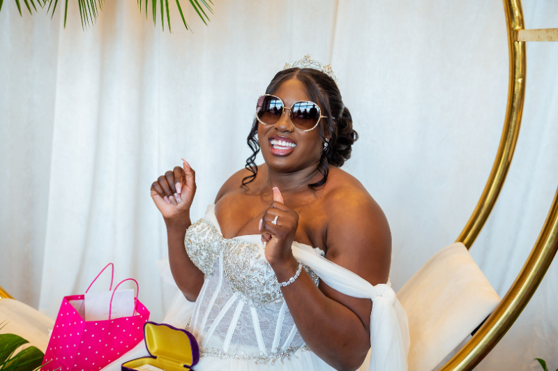 bride smiles in sunglasses