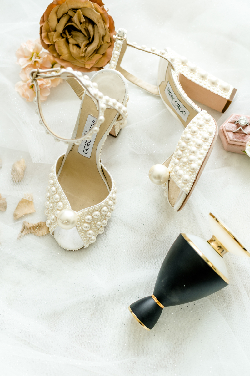 CLOSE UP OF BRIDAL SHOES AND ACCESSORIES