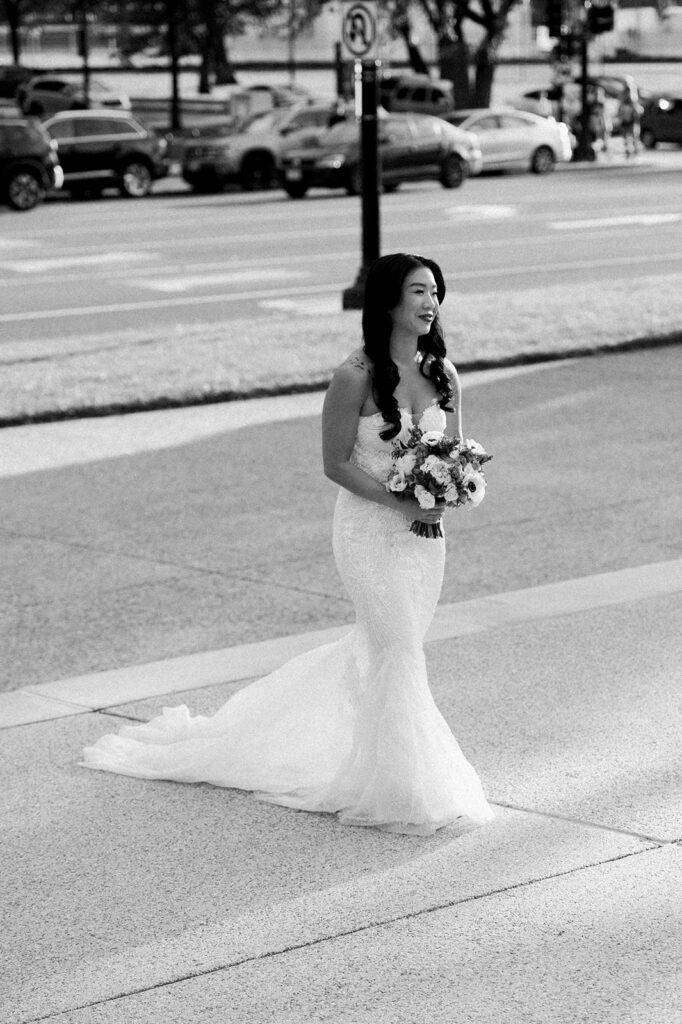 Bride walks across DC streets to enter her wedding ceremony. 