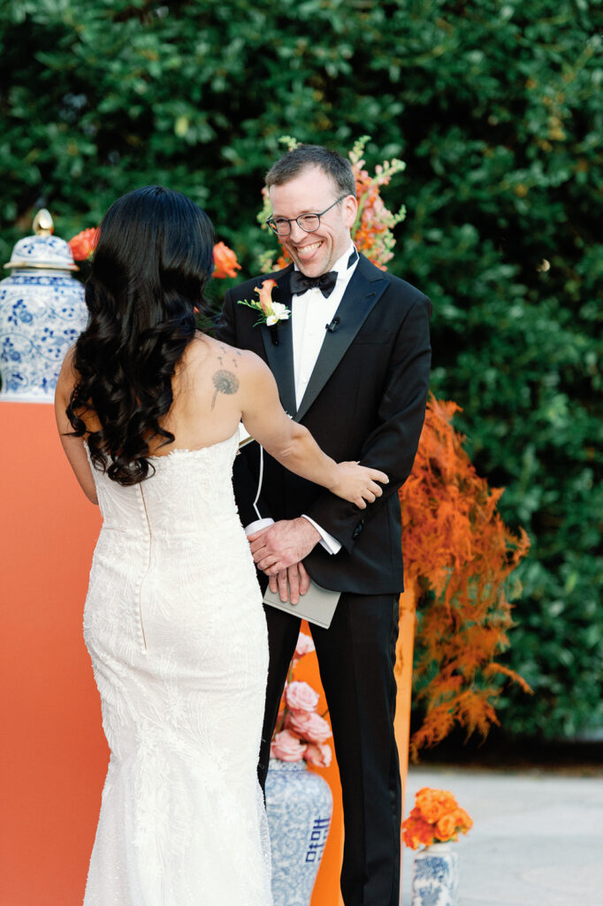 Bride and groom exchange vows during outdoor fall wedding ceremony at Potomac View Terrace. 