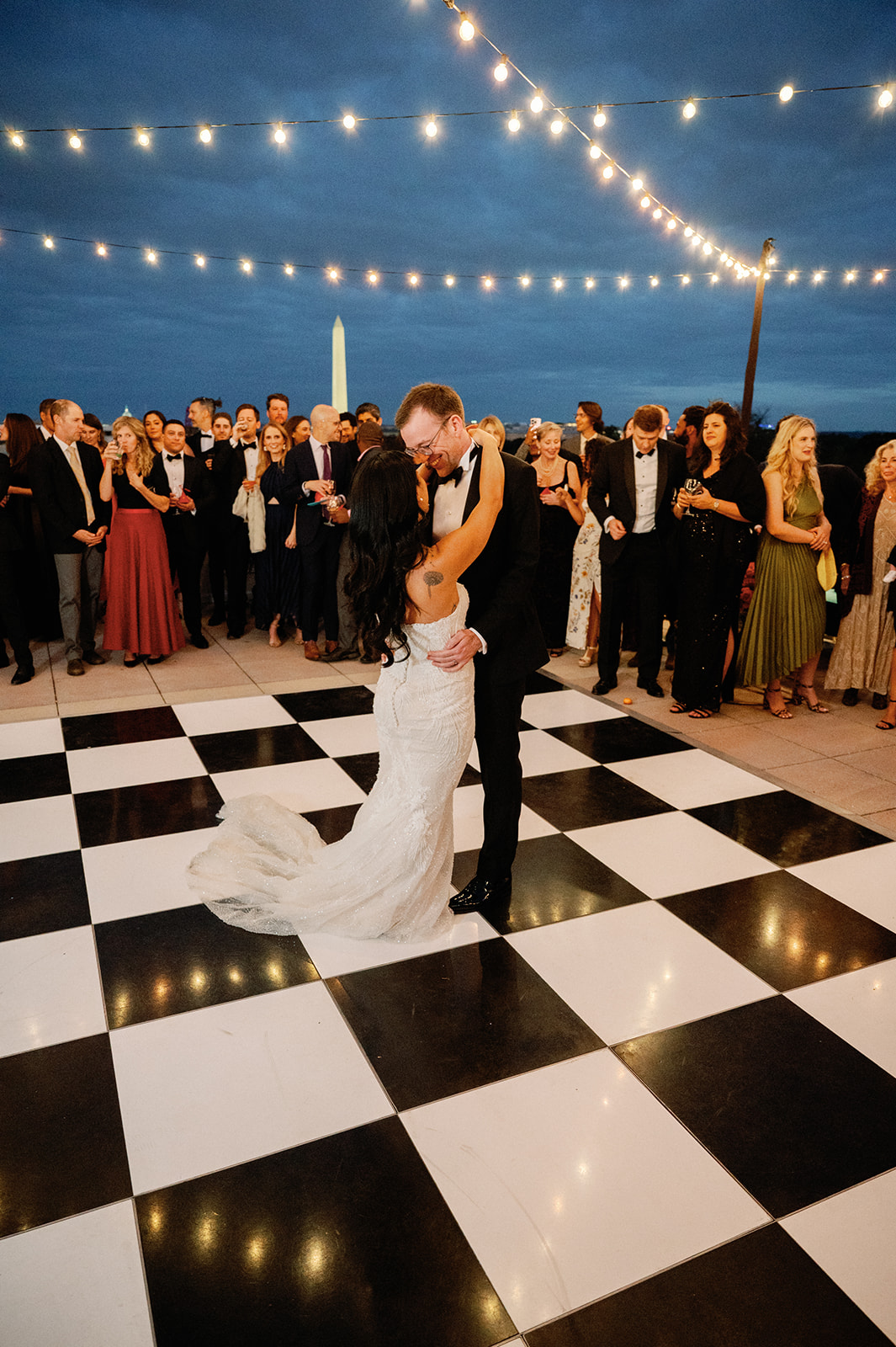 Bride and groom share first dance during their rooftop reception of their Potomac View Terrace wedding.