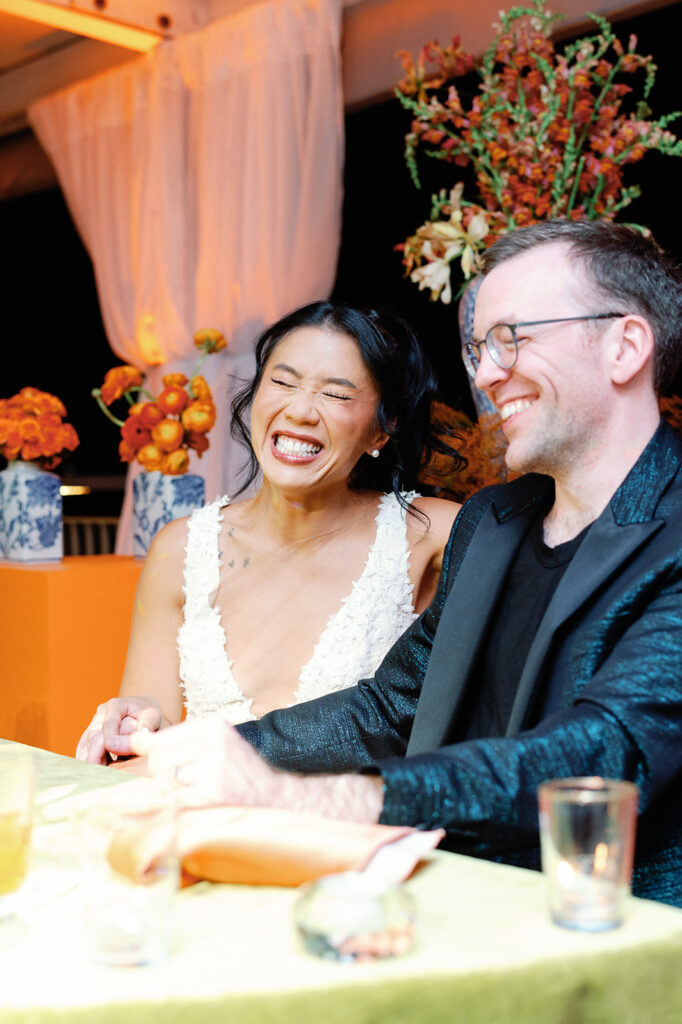 Bride and groom ecstatic after final outfit change during their reception.