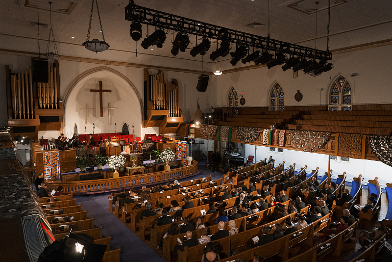 View of entire church getting ready for wedding ceremony.