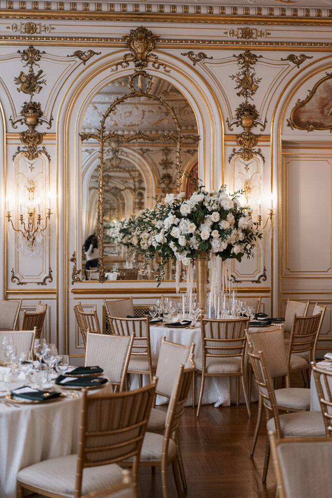 Elevated table settings with lush florals and gold details for Cosmos Club wedding.