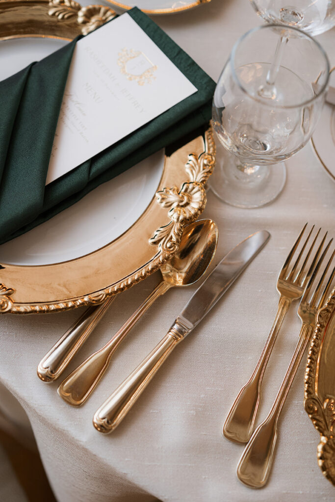 Gold flatware for elevated and regal wedding reception.