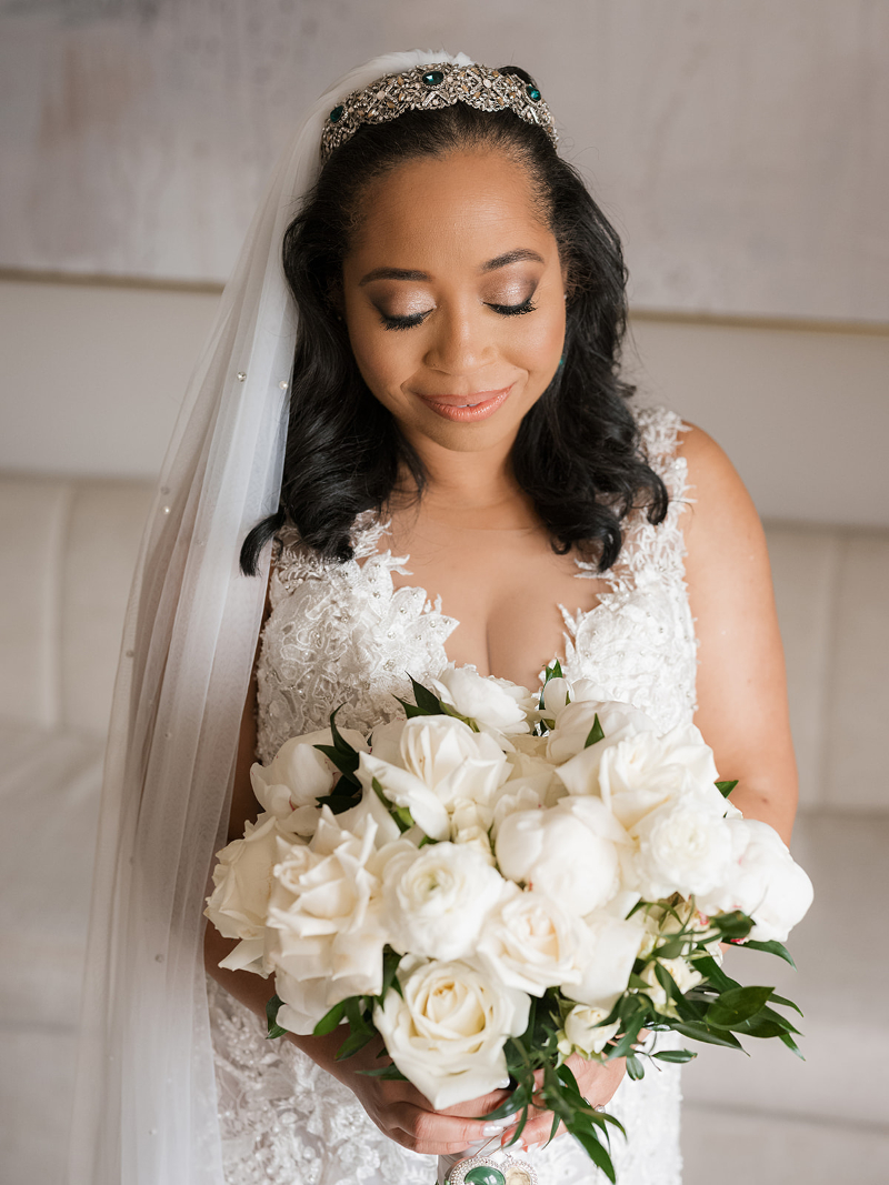 Bride poses for portrait. 