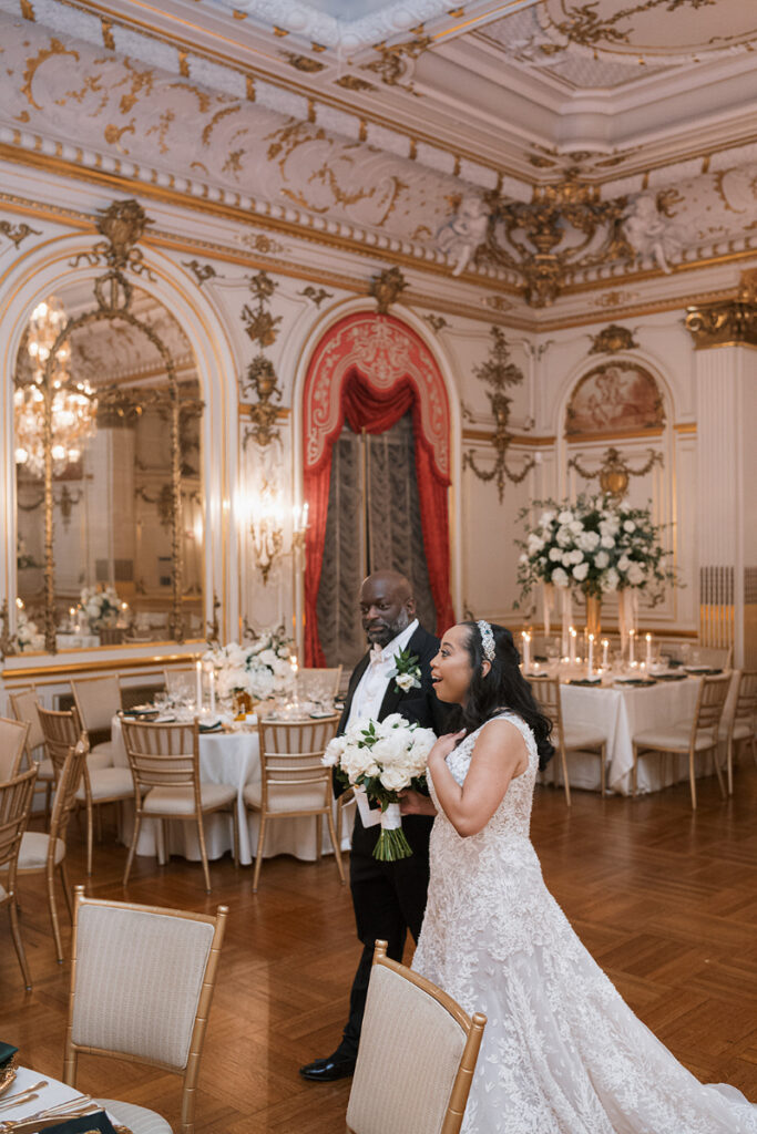 Bride and groom ecstatic after their reception room reveal for their Cosmos Club wedding.