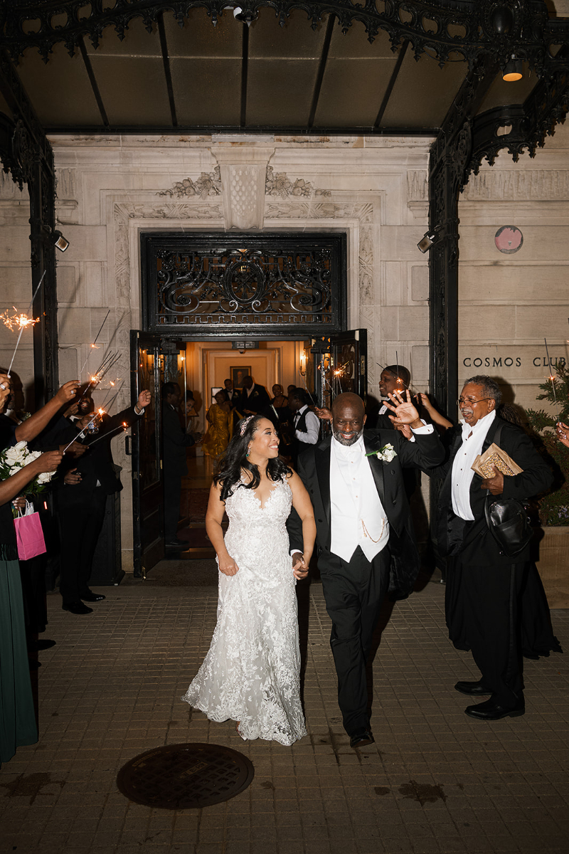 Bride and groom exit their Cosmos Club wedding into a sparkler exit.