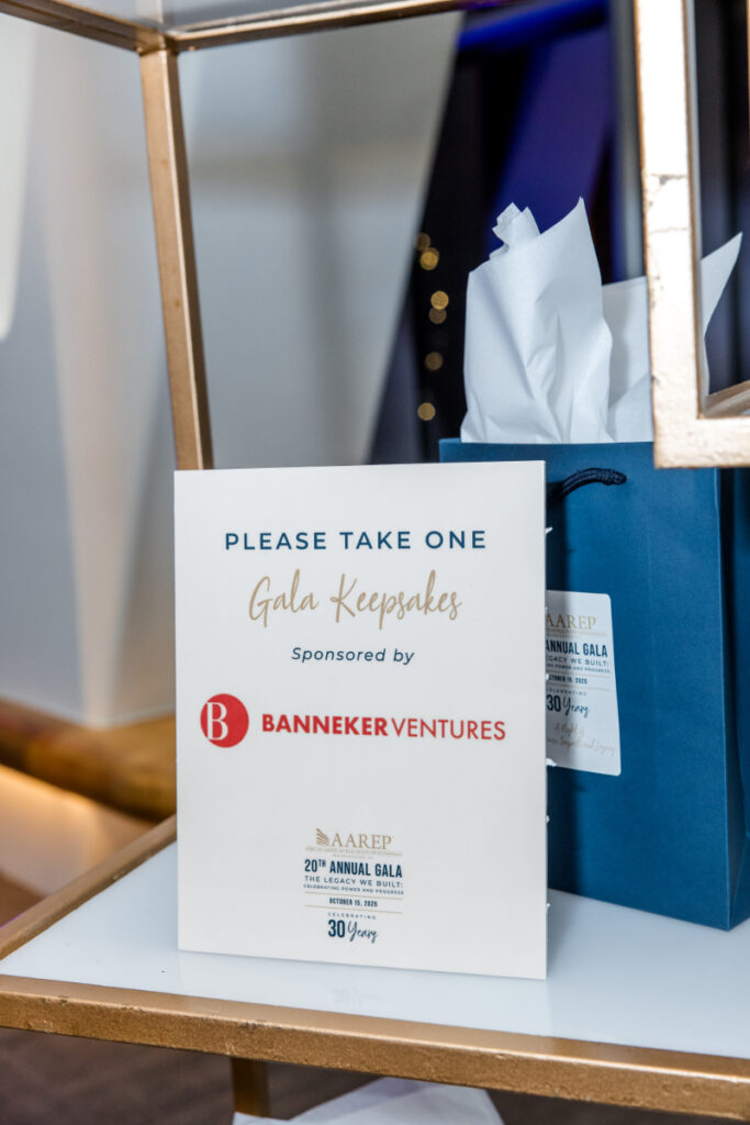 AAREP gala gift bags with sponsor signage.