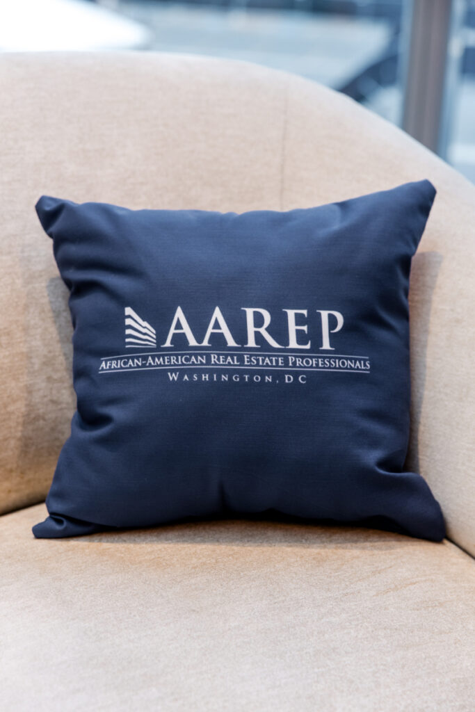 Custom blue AAREP logo throw pillow.