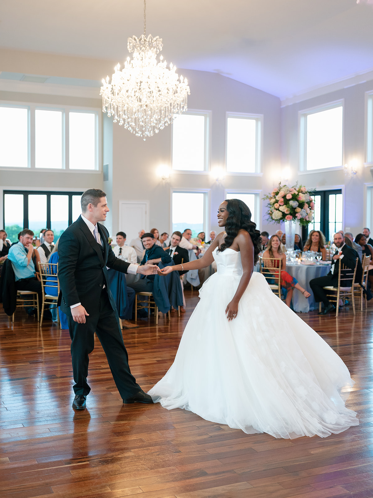 Bride and groom share first dance in front of their guests at their mansion wedding reception in The View of Bluemont.