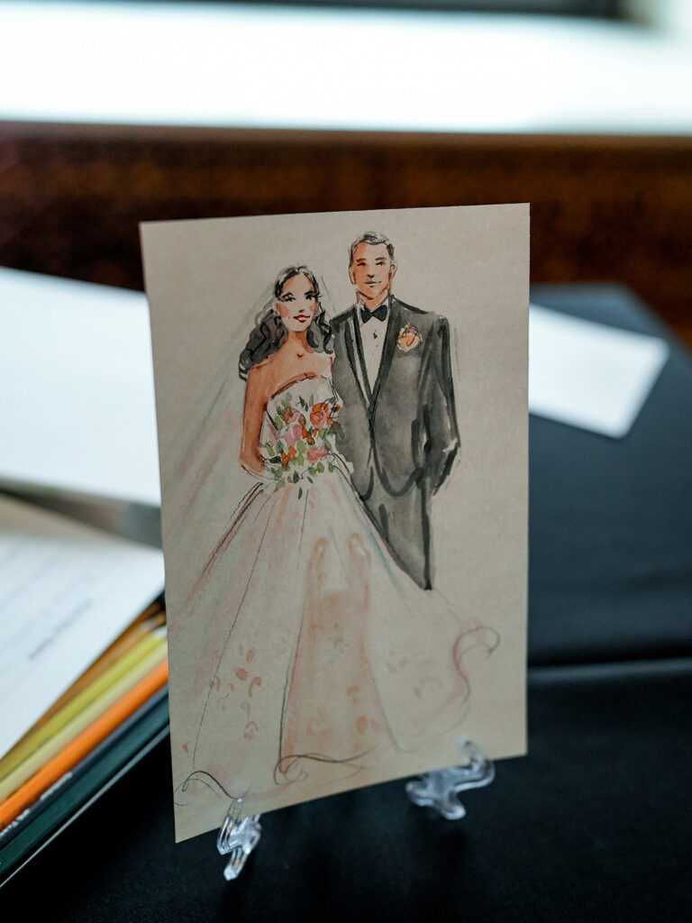 Custom wedding illustration of the bride and groom displayed at the reception as a personalized keepsake.